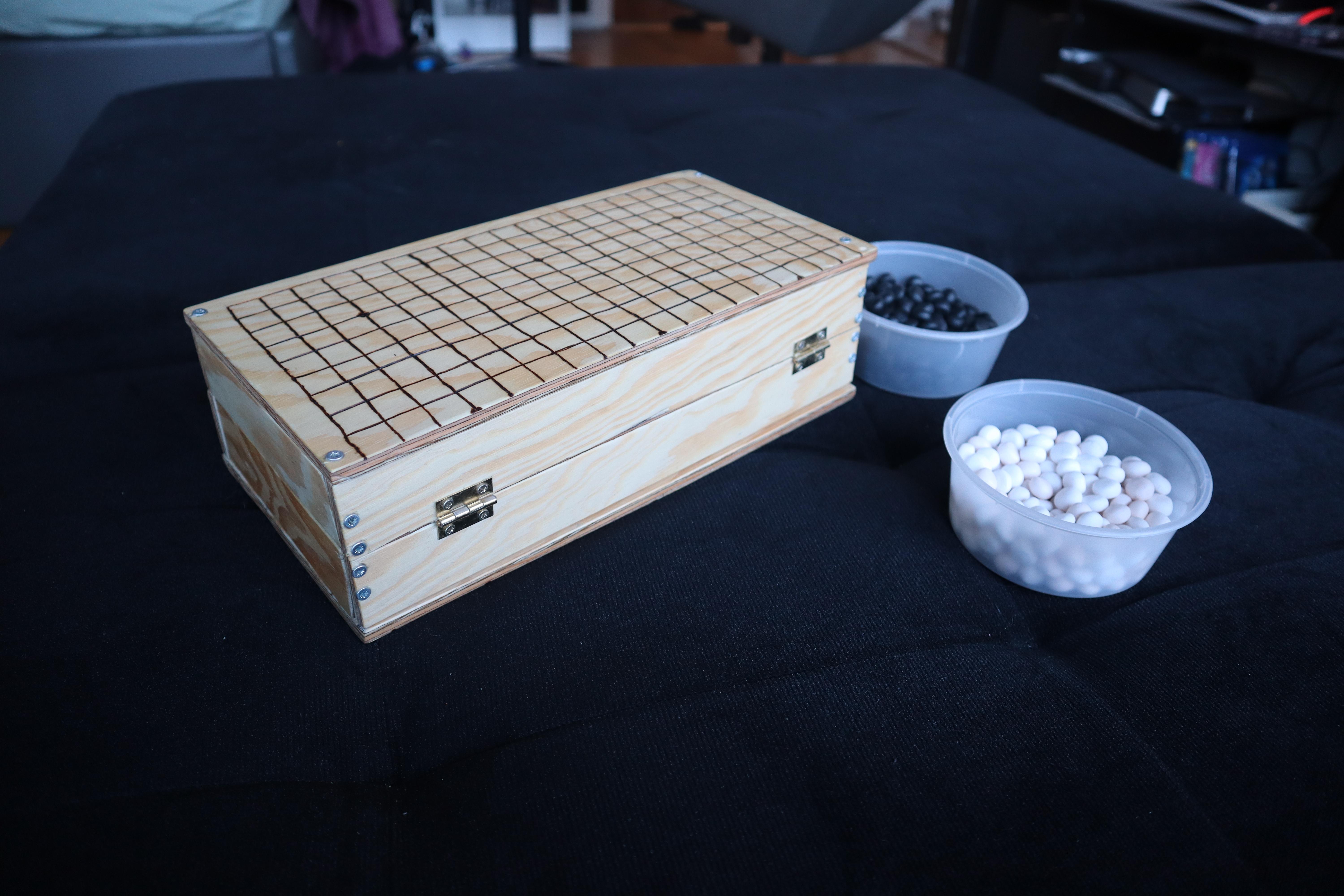 The same board rotated to show its brass hinges