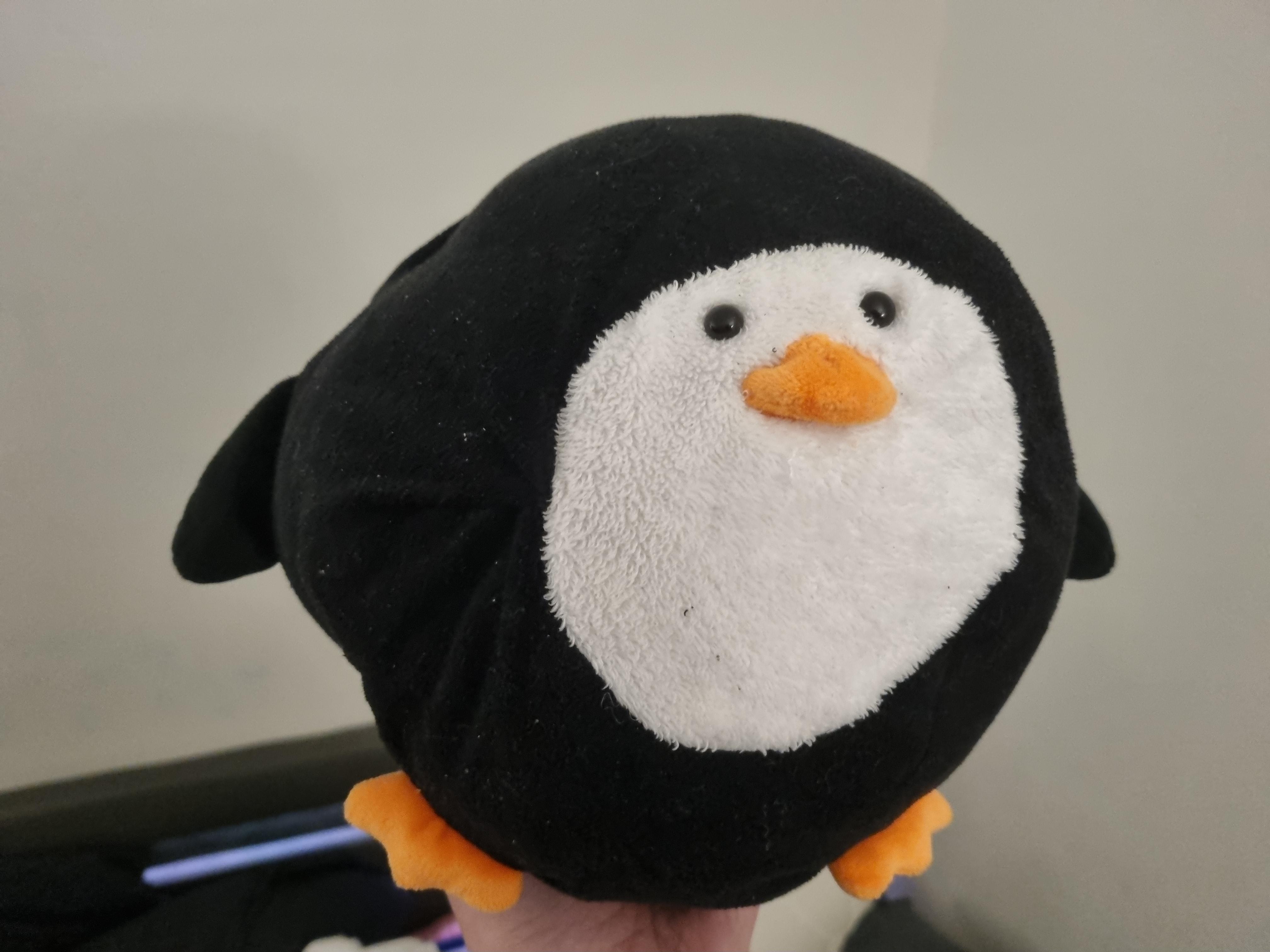 Picture of a spherical plush penguin. Very round, very soft.