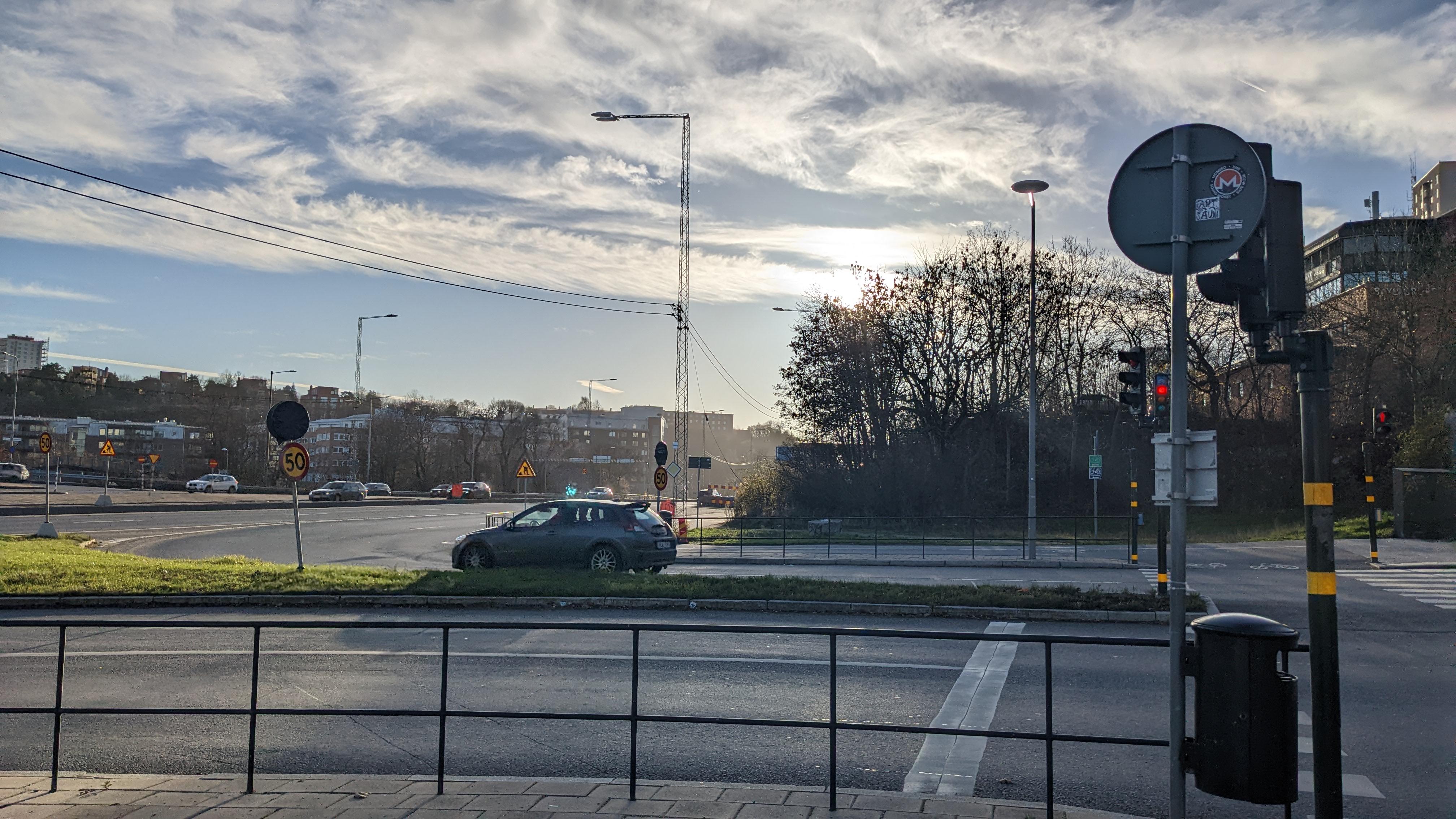 The Swedish winter sun, low in the sky, peering out from behind leafless trees