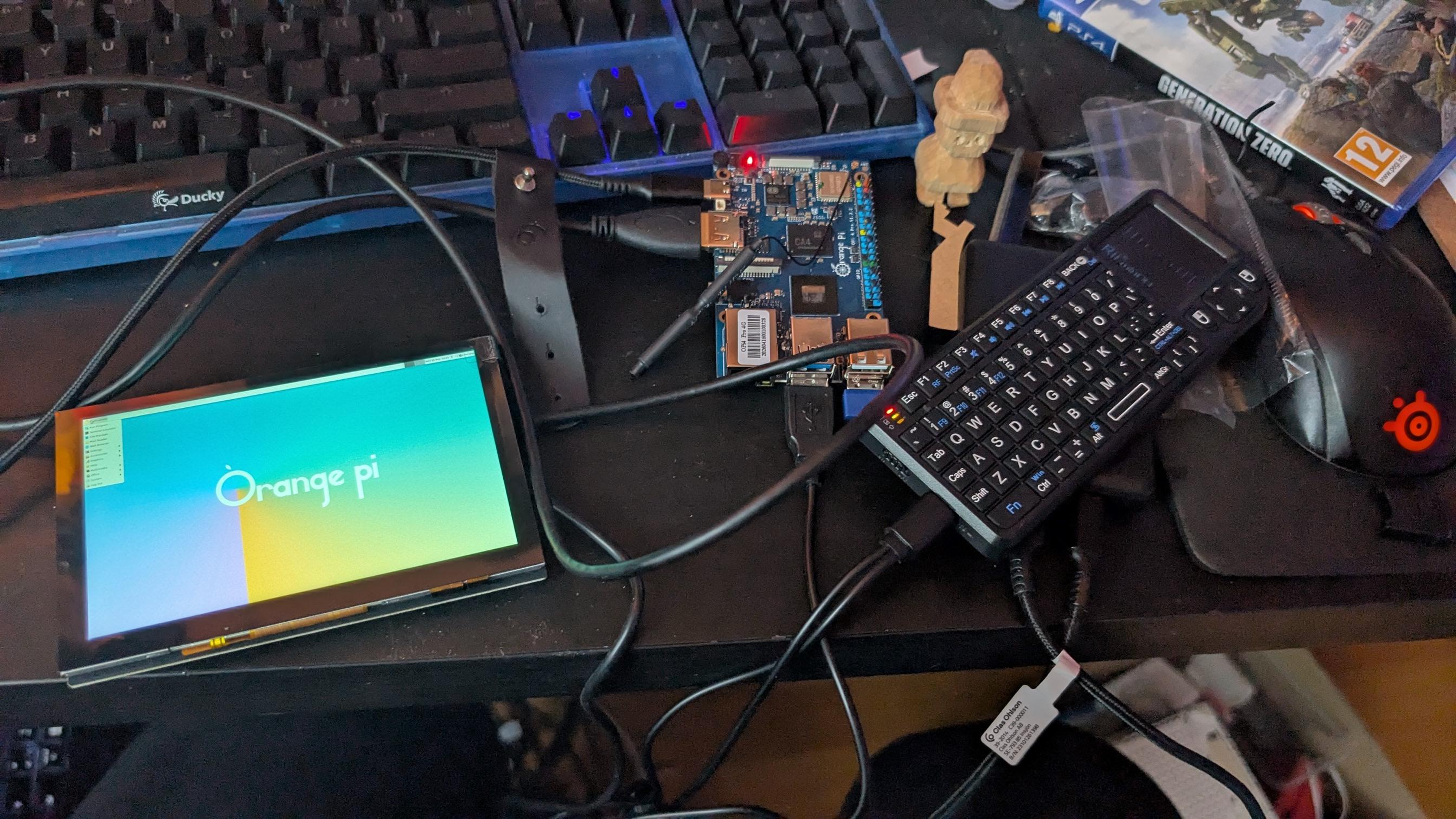 Photo showing a cyberdeck, a portable computing device with keyboard and touchpad, 3d printed in sparkling purple and copper, with copper colored embellishments