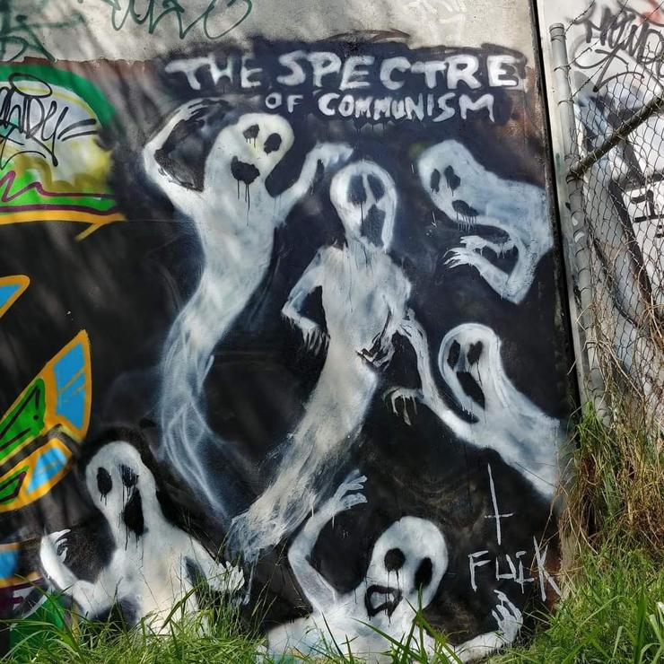 Mural on a wall of ghosts and the words "The spectre of communism"